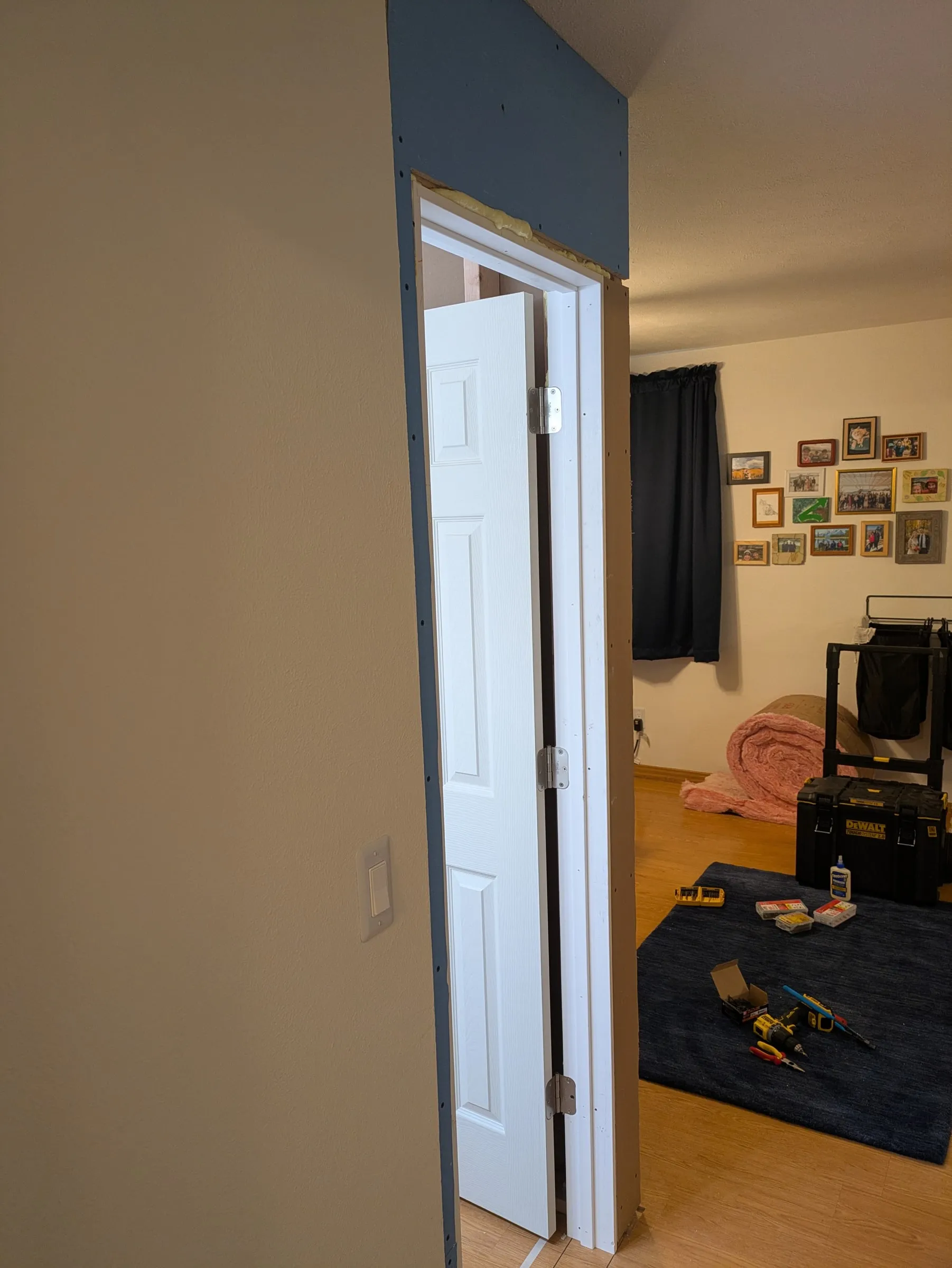 The door on its hinges, swinging clear
