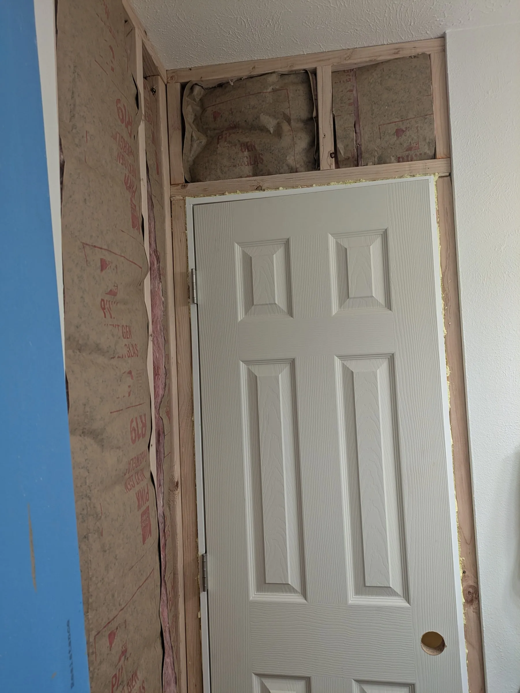 Insulation in the framing above the door