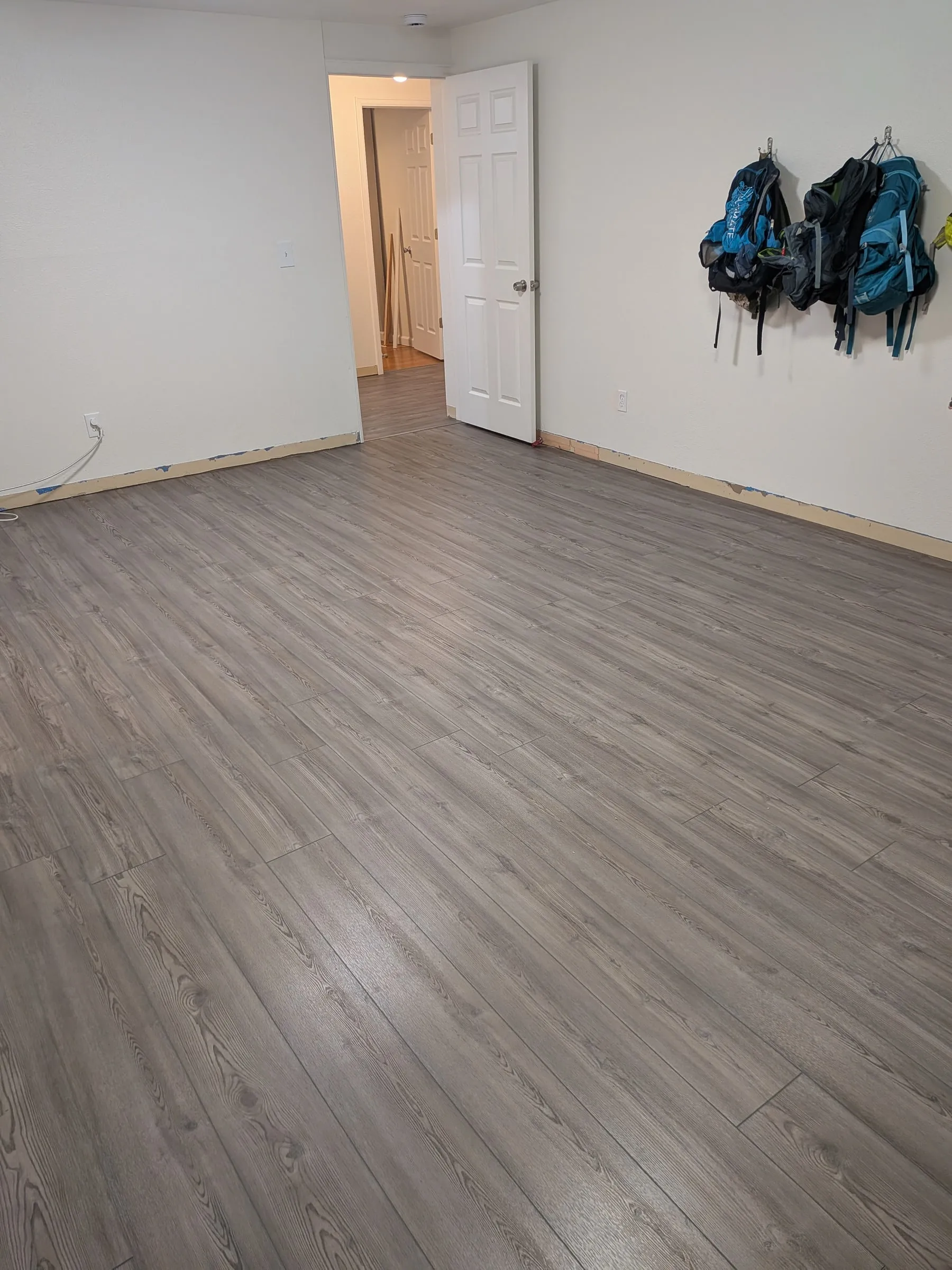 The rec room floor fully in, before baseboards